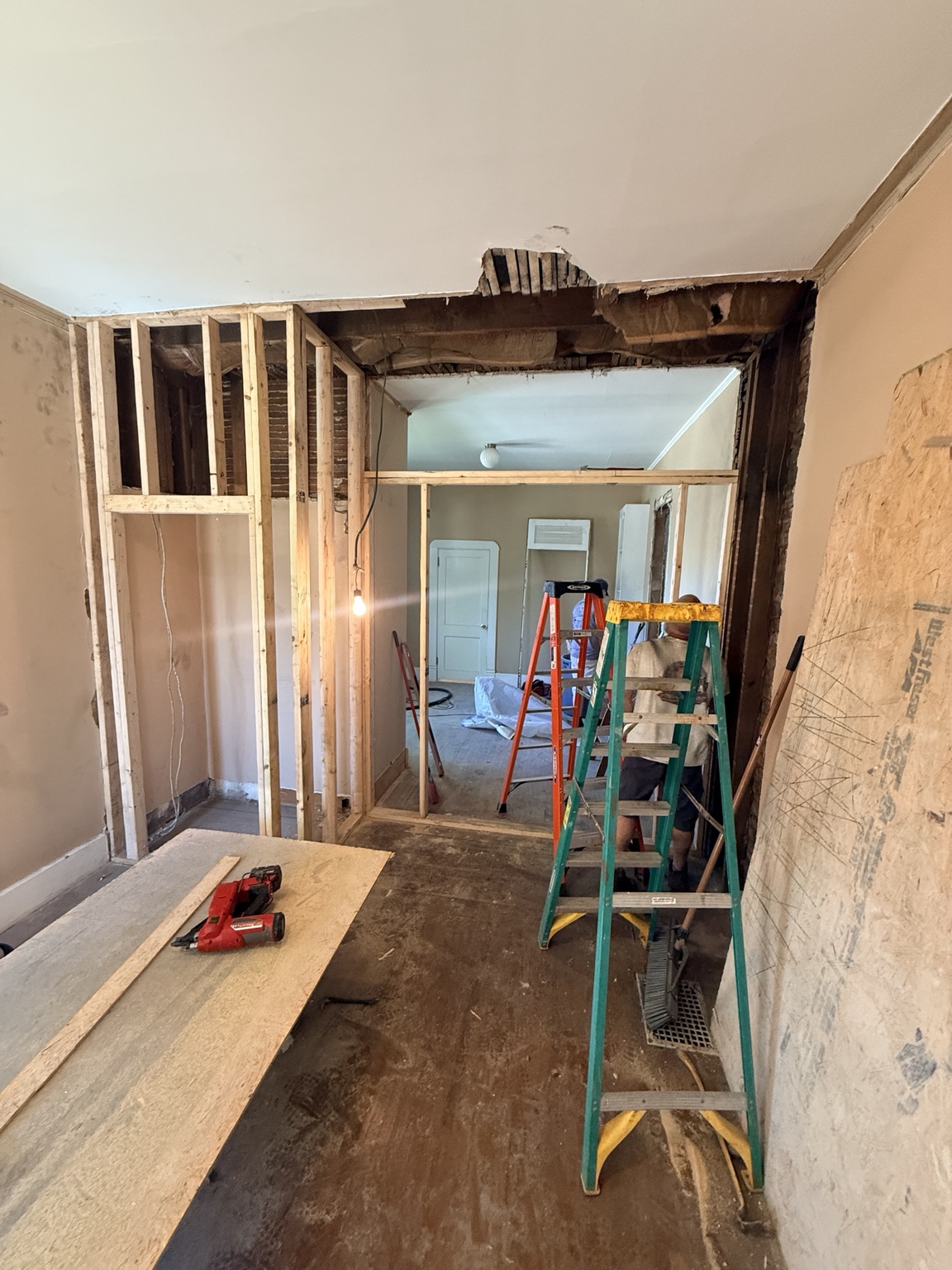 Exposed framing and ladders in an interior renovation