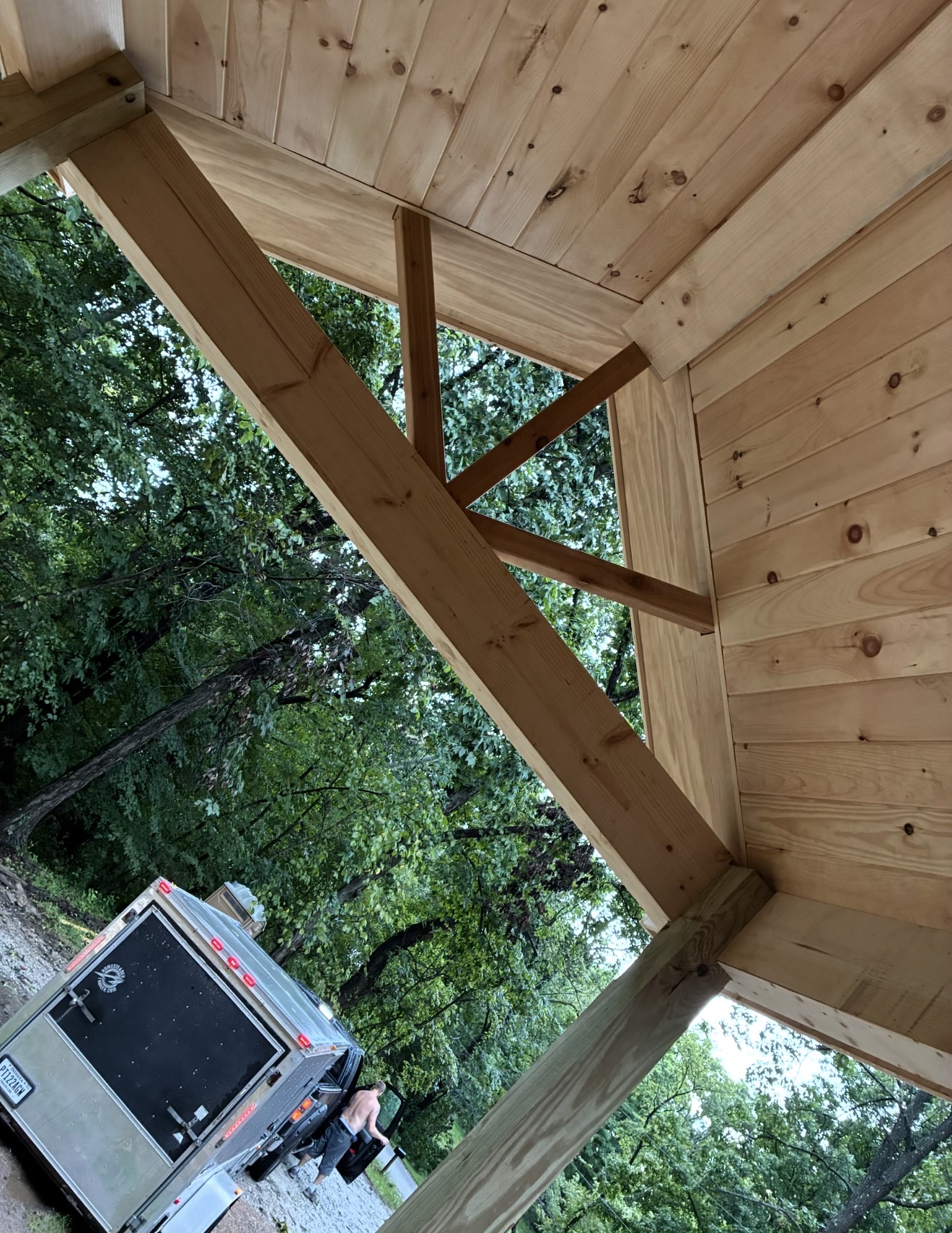 Wood gable ceiling and timber beam connections viewed from below